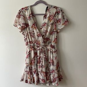 Ruffled romper. Light pink with florals
